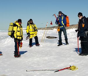 Expeditions cross sea ice, watched on by seal