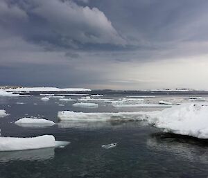 View from wharf hut which looks over the sea ice and water — beautiful