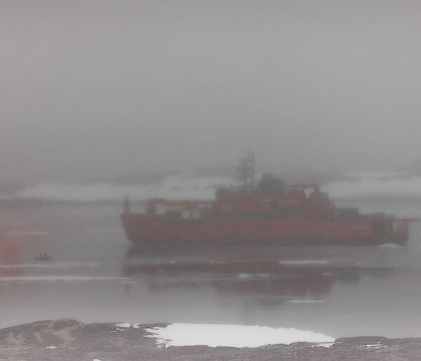 Ship departs station and flares are lit to farewell captain on his last antarctic trip