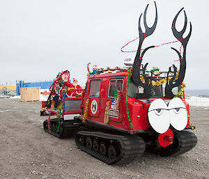 Santa arrives on station in a Hägglunds oversnow tracked vehicle