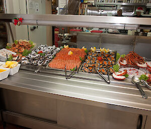 A cold buffet in the bain-marie area of the mess featuring mainly seafood