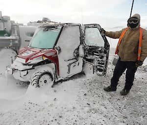 Vehicle packed full of snow after blizz