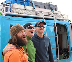 Three expeditioners standing together for one last good by photo