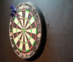 Darts in the dartboard after a players turn.
