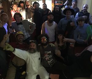 A group photo of people dressed up as their supposed look-a-like.
