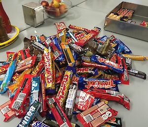 The fortnightly pile of new chocolate bars on the table.