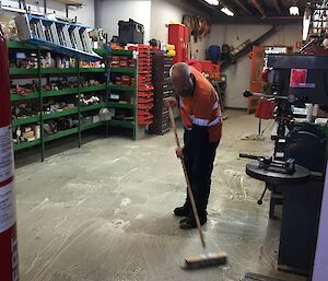 Cameron washing the floor in preparation for the painter to re-paint the floor.