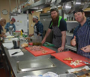 The second round of cooking class with new pupils preparing the pizza topping to go on their pizza dough which they made earlier.