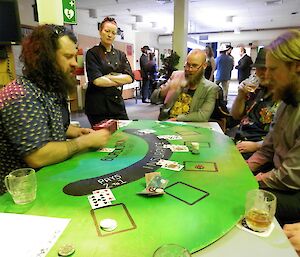 Adam dealing out the card at the black jack table.