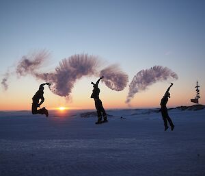 Boiling water vaporising as the Casey Met Team throws cups of it into the air.