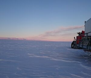 Accommodation van being towed by a tractor with Clouds Appearing as Ice Cliffs