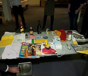 The varied contents of the capsule laid out on the table.