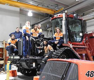 Summer mechanical team on a QuadTrac tractor for a team photo.