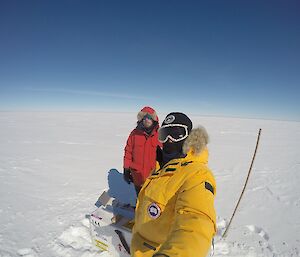 Two expeditioners dressed in their outdoor winter clothing.