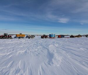 Three QuadTrac machines with trailers as well as the troop carrier and two Hägglunds all lined on the track.