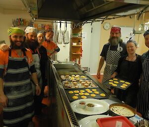 Group photo of AJ, Adam, Kiwi, Andy, Mick, Donna and Dean standing around some of the creations.