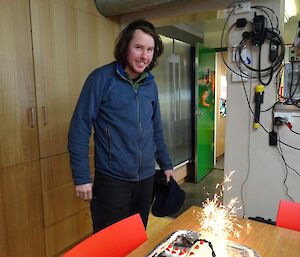 Steve with his birthday cake with sparklers.