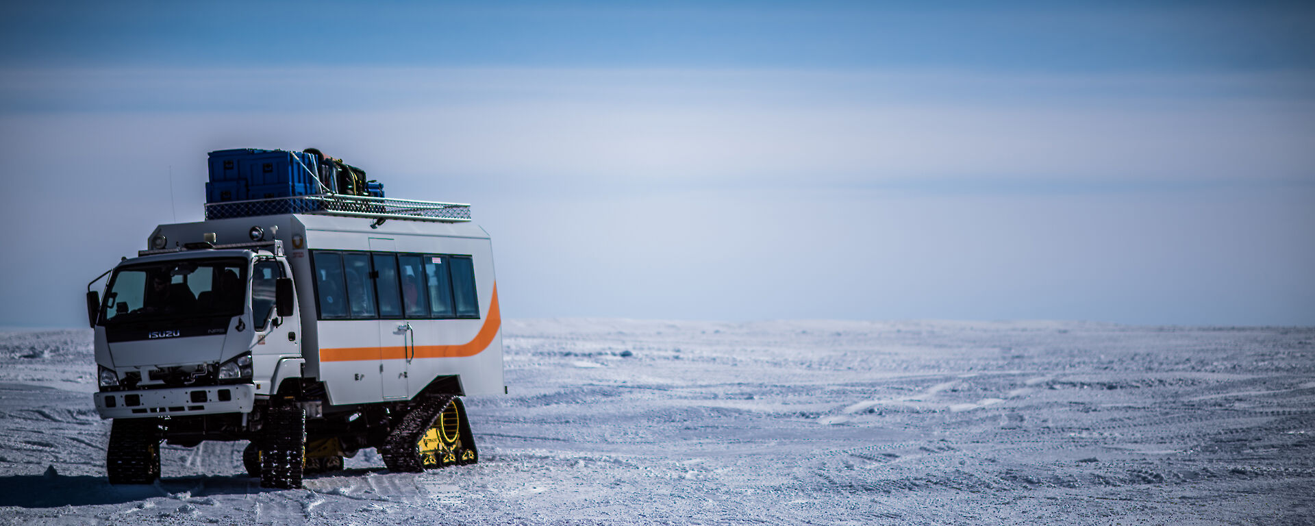 Tracked loaded bus leaves Wilkins airfield