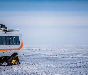 Tracked loaded bus leaves Wilkins airfield