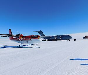 Two planes wait on the tarmac at Wilkins airfield.