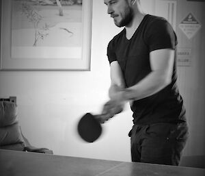 An expeditioner tries his hand at ping pong