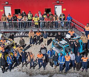 A group of Casey expeditioners are photographed with the Minister outside the new East Wing accommodation block.