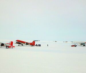 Three aircraft parked on the apron at Wilkins airfield