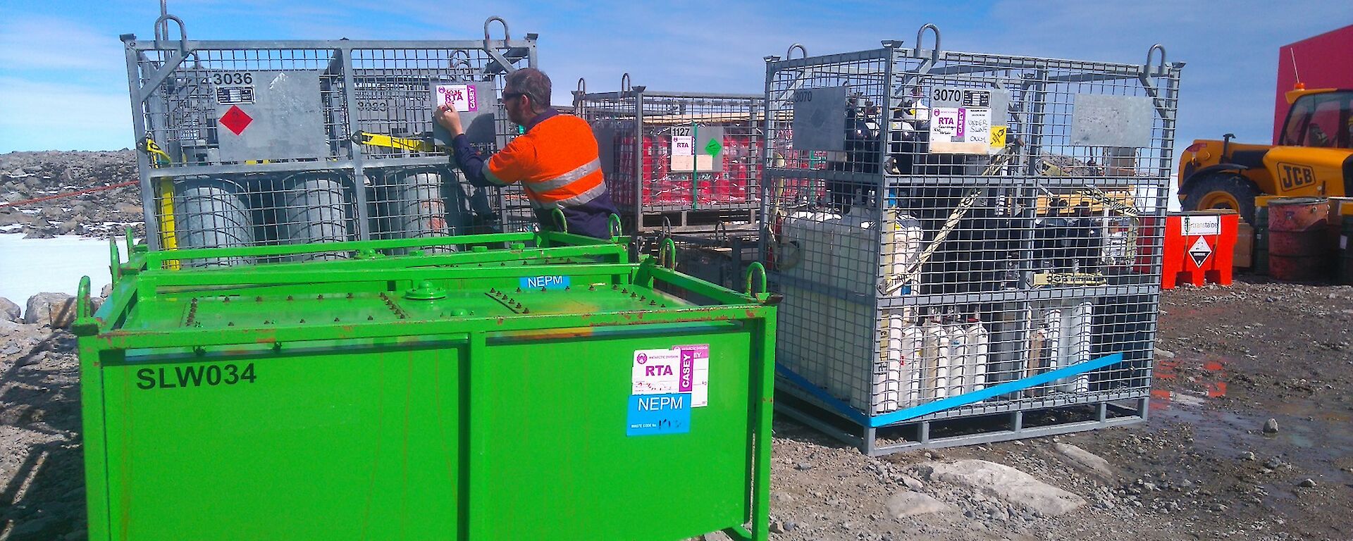 Gas bottles are put in containers for return to Australia
