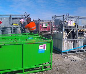 Gas bottles are put in containers for return to Australia