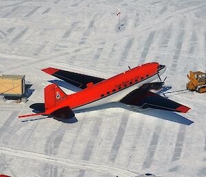 The JKB Aircraft is toed by a dozer at Casey Skiway