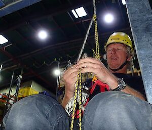 An expeditioner does rope work as part of SAR Training