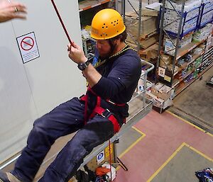 An expeditioner does rope work as part of SAR Training