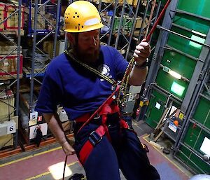 An expeditioner does rope work as part of SAR Training