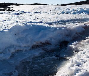 An image of melt water running to the ocean near Casey Station