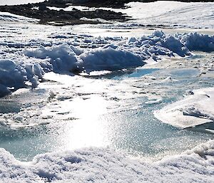 An image of melt water running to the ocean near Casey Station