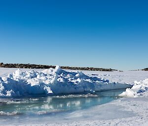 An image of melt water running to the ocean near Casey Station