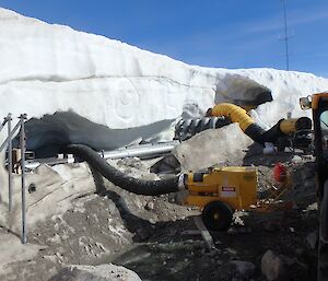 A photo one week after beginning shows some pipes in the melted snow.