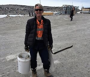 An expeditioner shows some of the rubbish they have collected