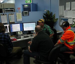 A Casey forecaster gives a weather briefing to an air crew