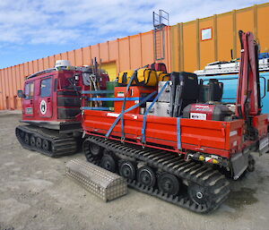 A Hägglunds and trailer packed for the traverse