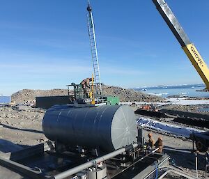 A ladder is lowered into the fuel tank