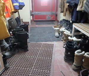 One of Casey station’s cold porches with lots of boots lined up.