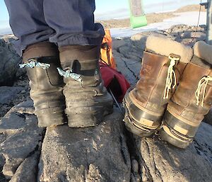 Two pairs of boots with string markers attached
