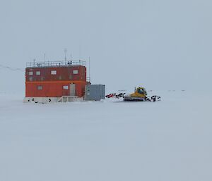 Wilkins Operations Centre — a red rectangle building with lots of snow around it.