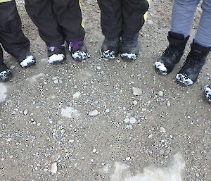 The snow-capped boots of the returning expeditioners