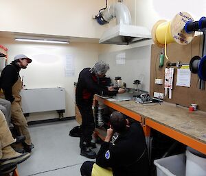 A field training officer demonstrates using a lantern