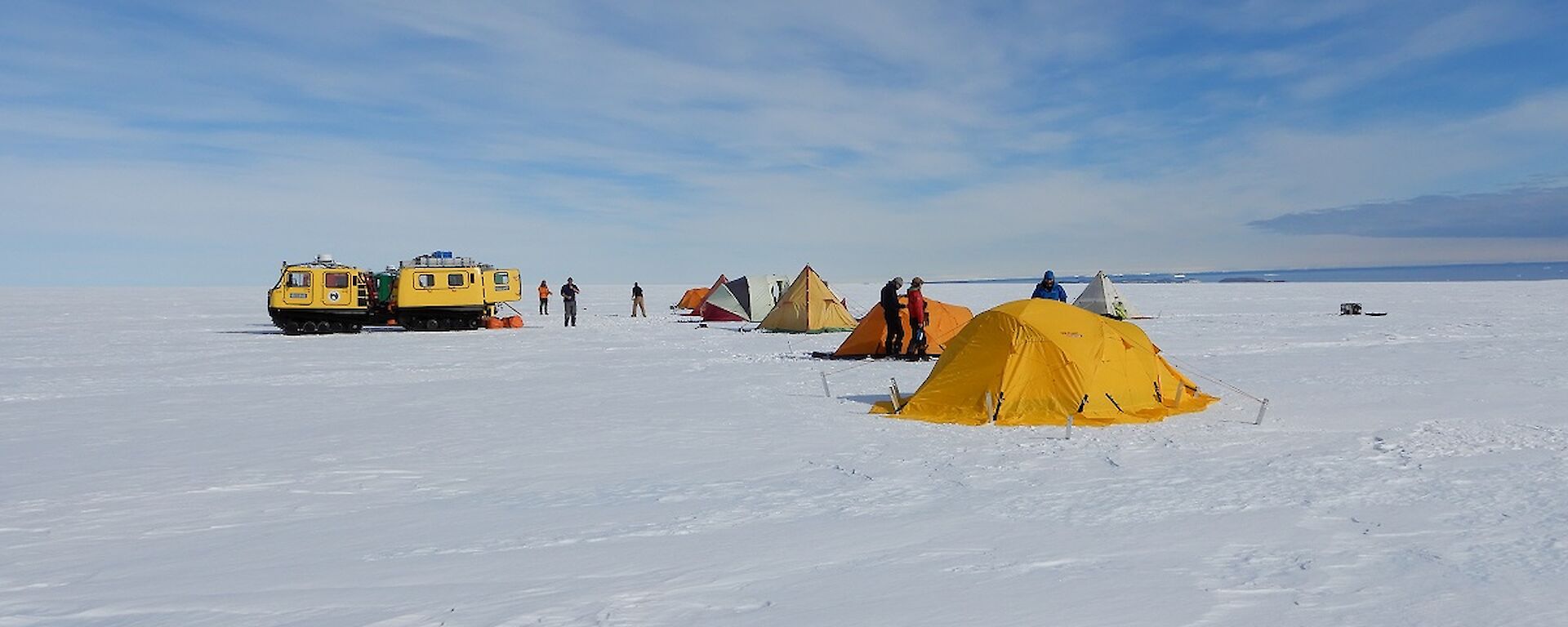 Tents are set up on the ice.