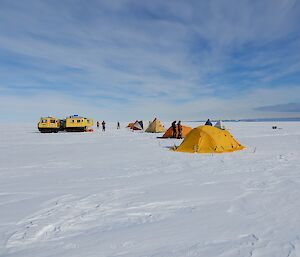 Tents are set up on the ice.