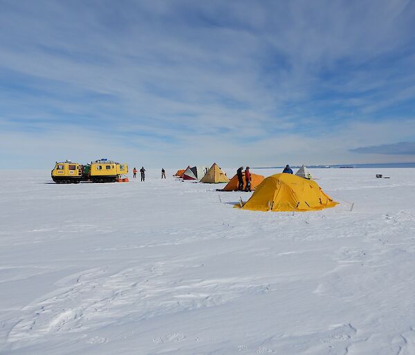 Tents are set up on the ice.