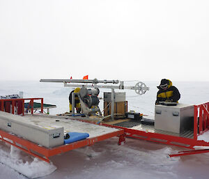 Men assembling the ice drill.